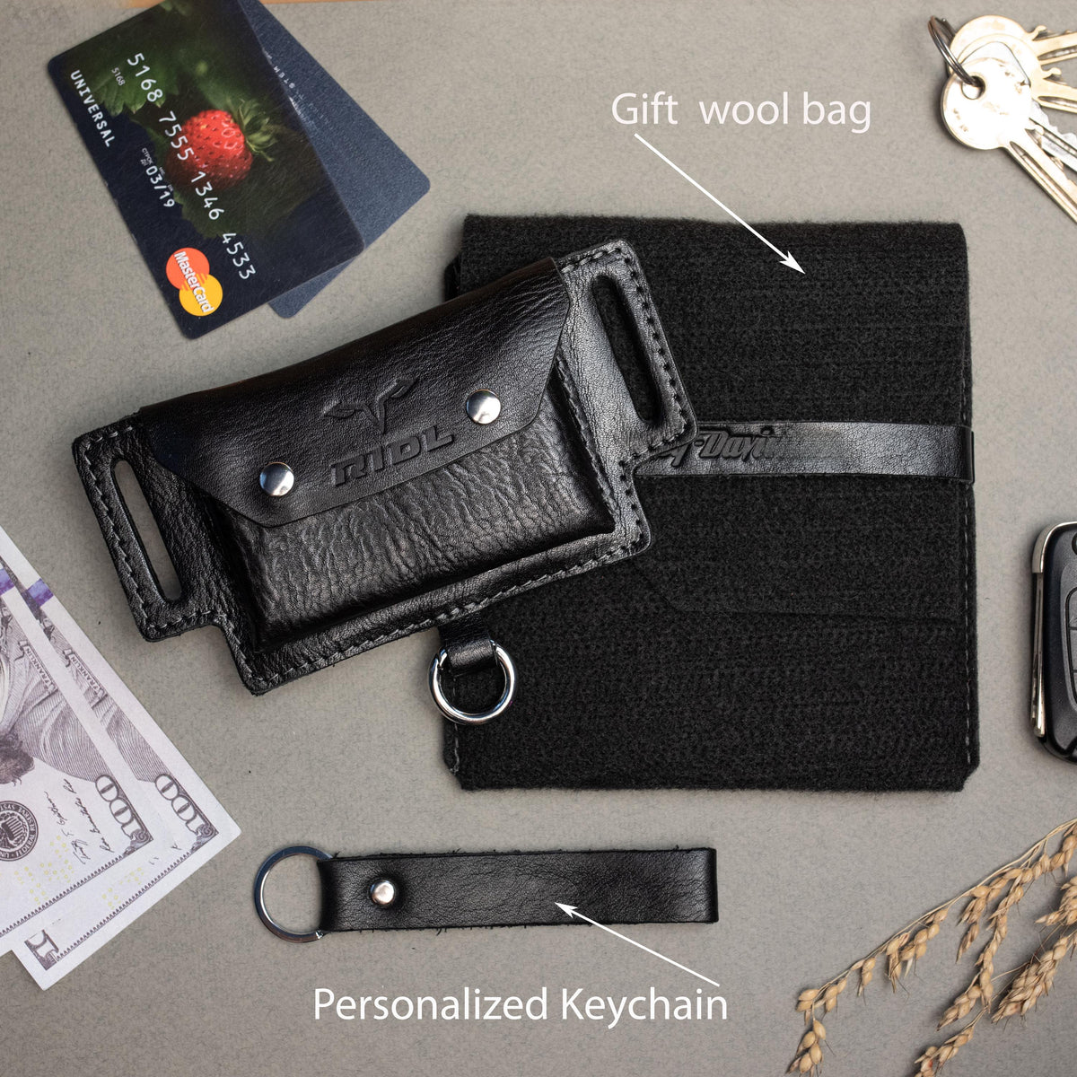 Black leather belt pouch with two snap pockets, key carabiner, wool gift bag and leather keychain
