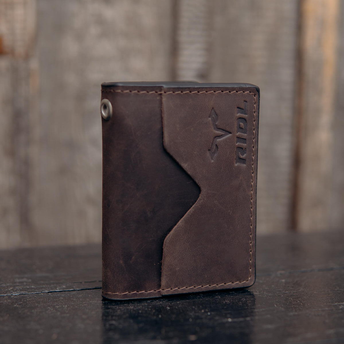 Handmade leather EDC wallet with magnetic closure, zip pocket and ID window by RIDL