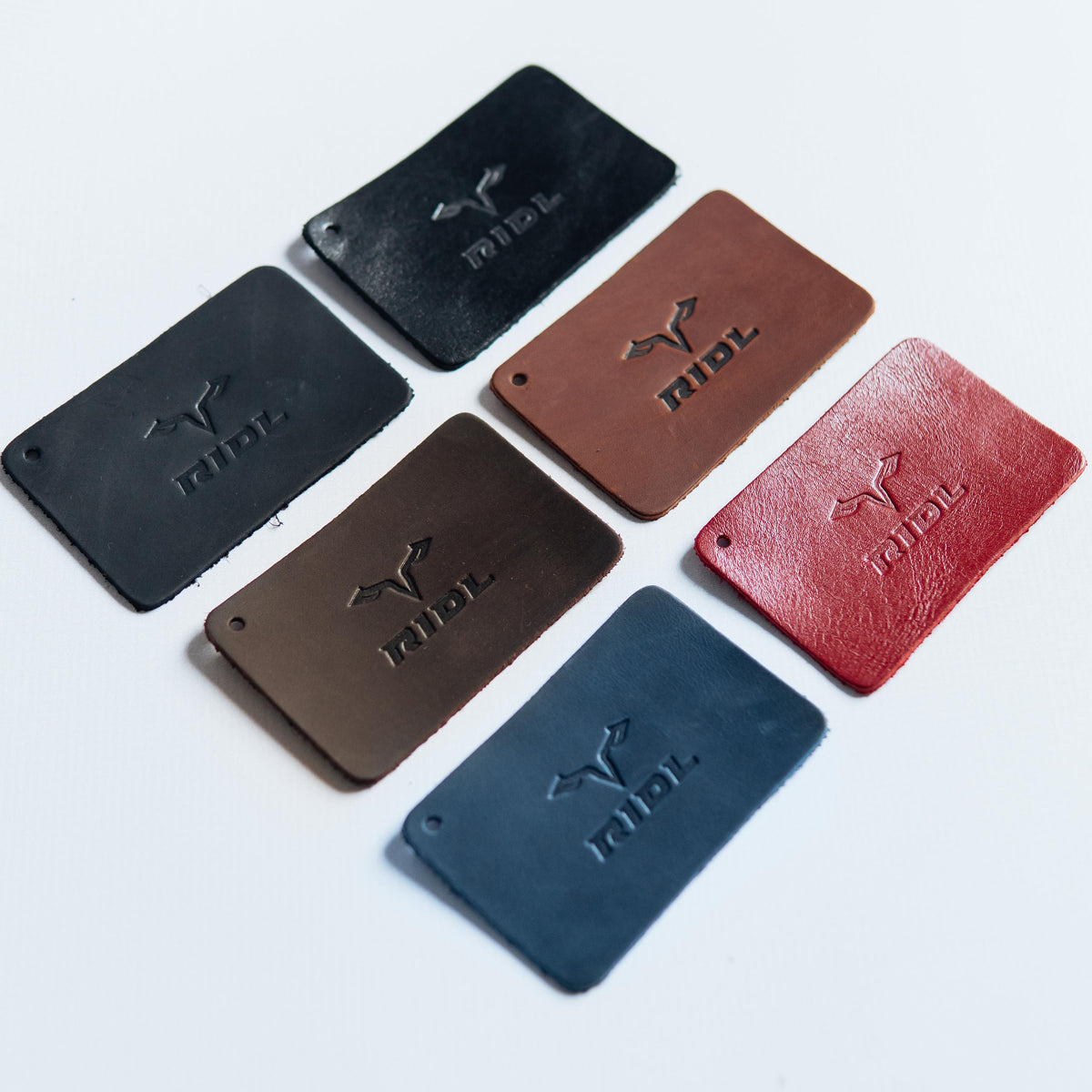 Handmade leather EDC wallet with magnetic closure, zip pocket and ID window by RIDL